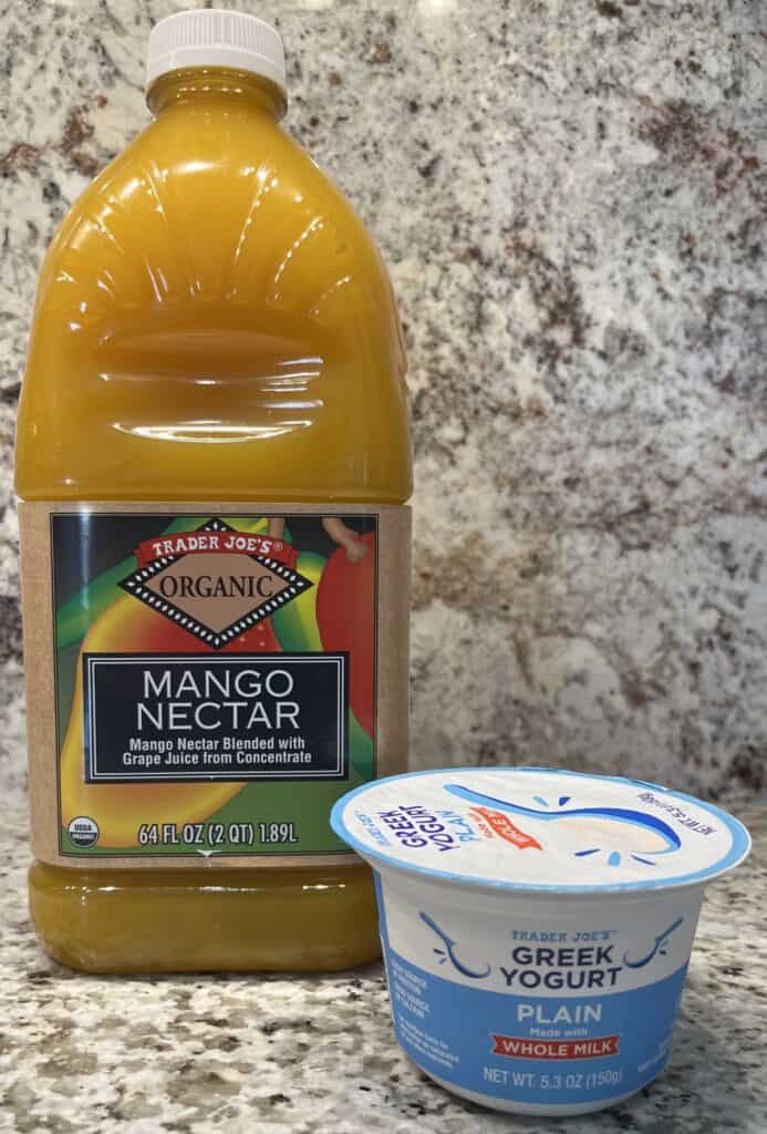 FBB_Beverage_Mango.Bliss.Yogurt.Delight_Ingredient.1200x1717. A photo of Trader Joe's Mango Nectar 64 ounce and Plain Whole Milk Greek Yogurt in their containers.