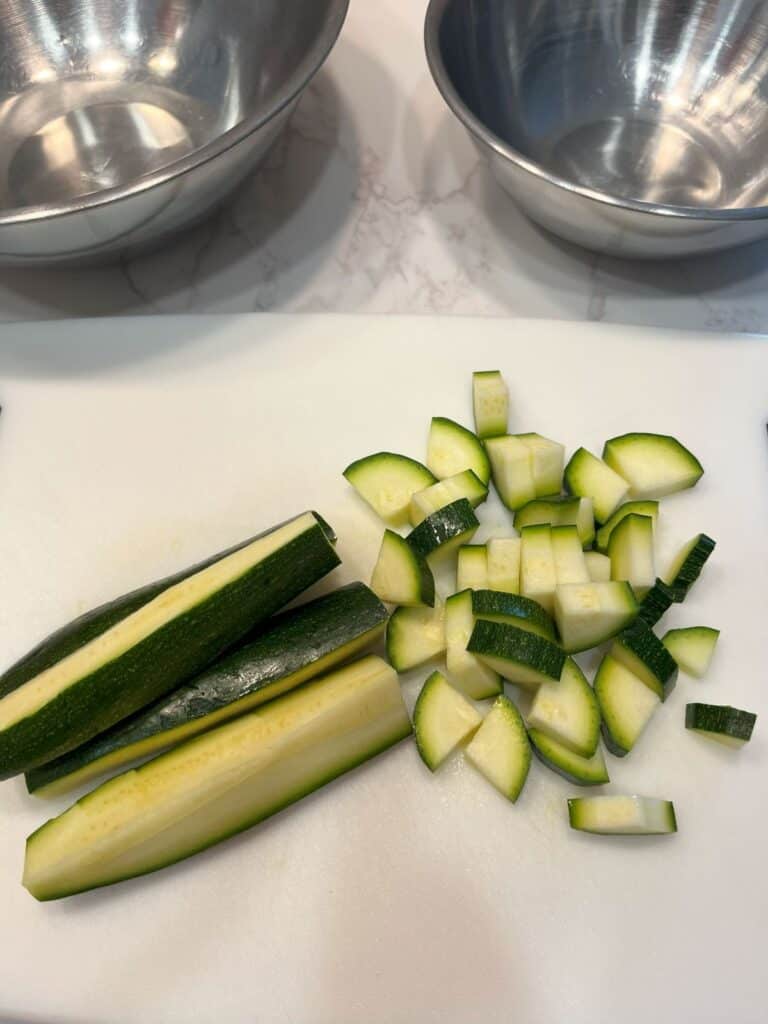 FBB_Side.Zucchini.Diced.1200x1600. Photo showing zucchini cut in four and diced.