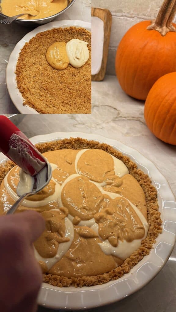 Pumpkin and NY-style cheesecake fillings being spooned and swirled together in a graham cracker crust.