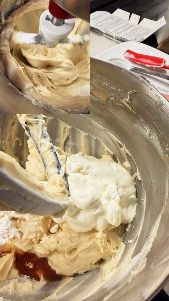 Cream cheese mixture in a metal mixing bowl with sour cream, vanilla, and cornstarch added, ready to blend.