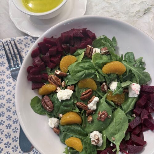 Fresh spinach, roasted beets, and crumbled goat cheese served with a bright citrus dressing.