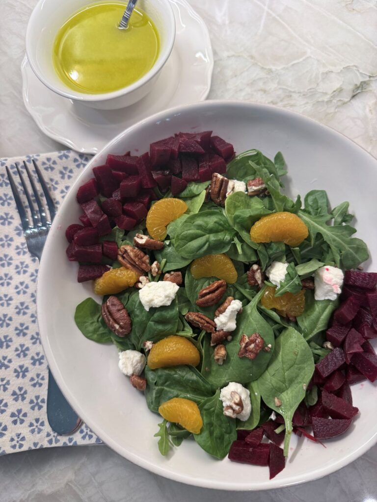 Fresh spinach, roasted beets, and crumbled goat cheese served with a bright citrus dressing.