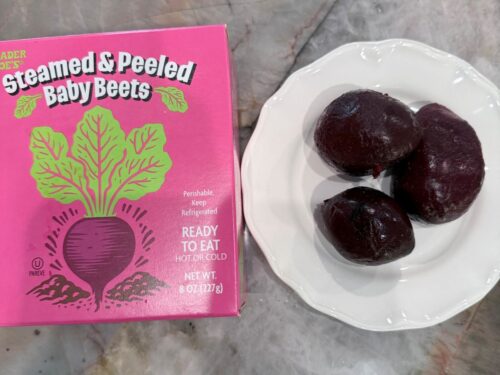 Trader Joe’s steamed and peeled beets shown next to a plate of small whole beets.