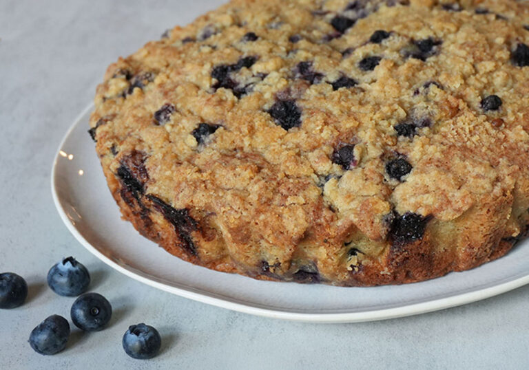 A golden blueberry crumble cake topped with a buttery streusel.