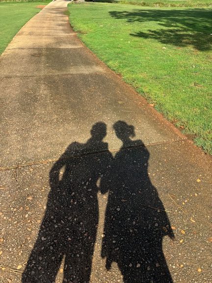 Our shadows casting on the pavement while out for a walk along the Green Valley Golf Course path on a quiet Monday.