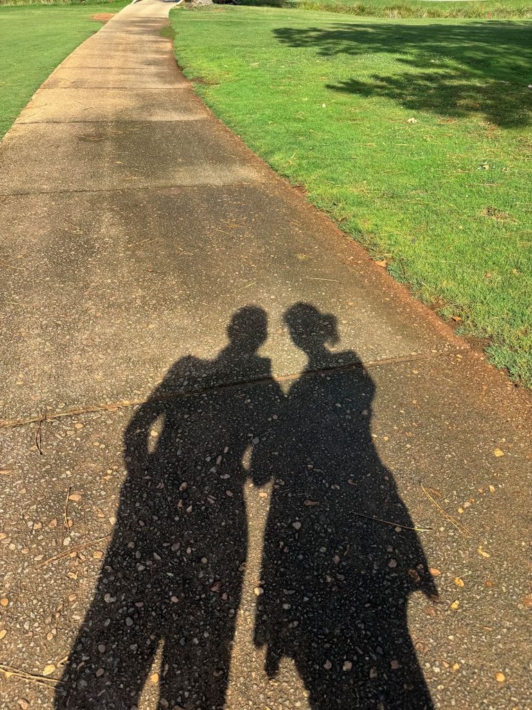 Our shadows casting on the pavement while out for a walk along the Green Valley Golf Course path on a quiet Monday.