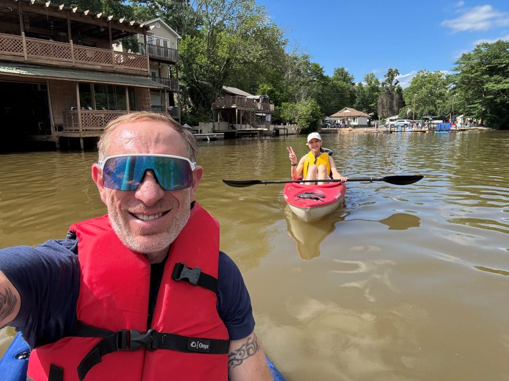 Samantha and Will kayaking at Saluda Lake Landing on a quiet summer afternoon.