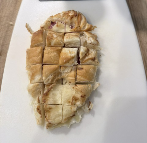 Cut croissant pocket into bite‑size pieces