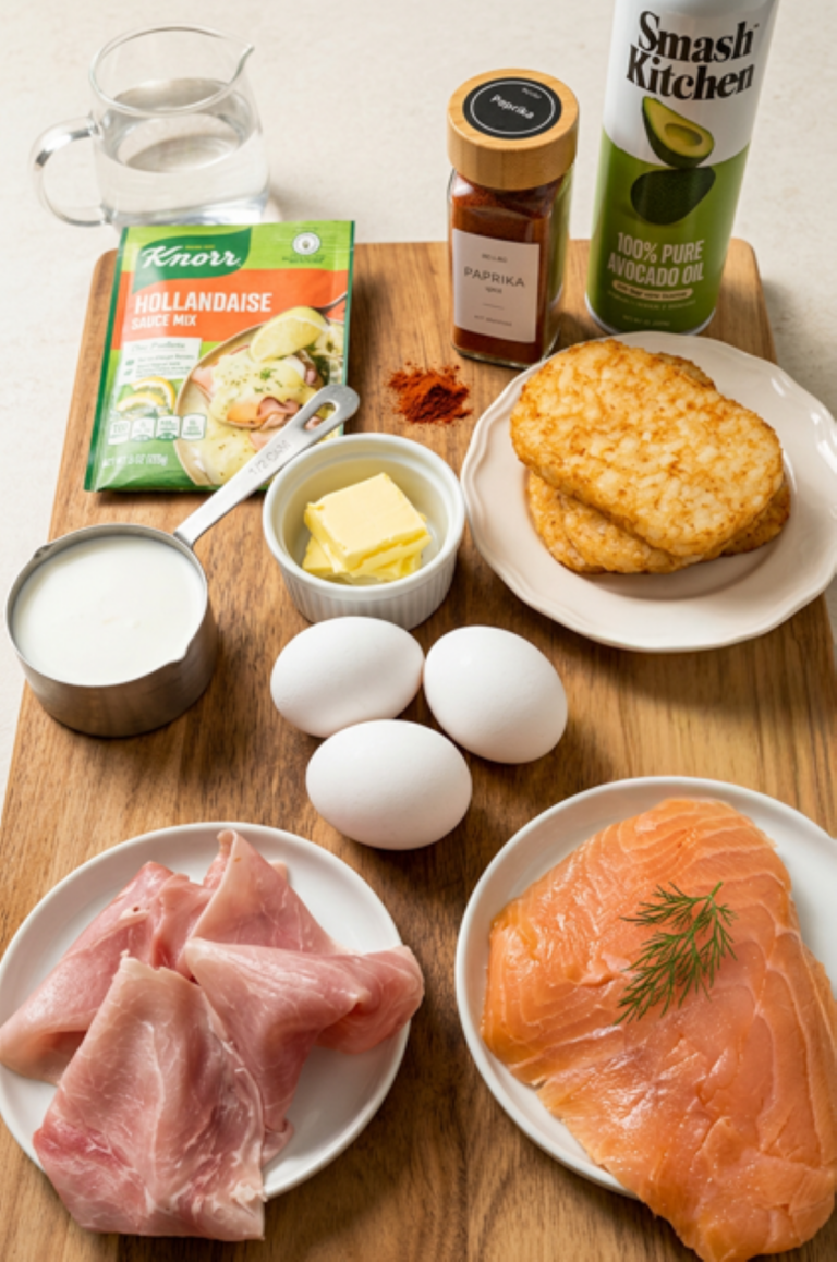 Ingredients for Crispy Hashbrown Eggs Benedict arranged on a table — eggs, hashbrowns, ham or lox, bread, and hollandaise components